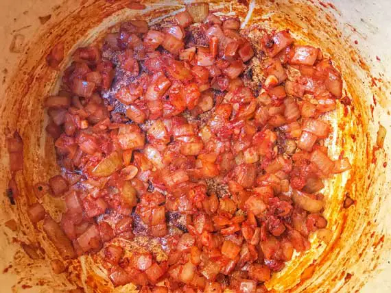 tomato paste to the onions and garlic
