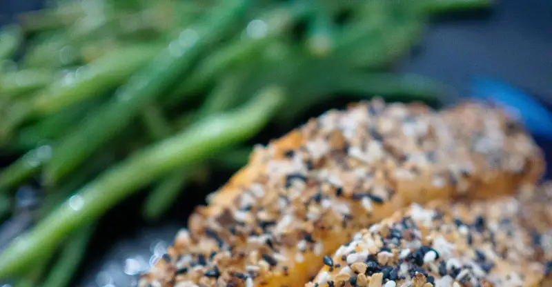 Close-up of cooked salmon and green beans.