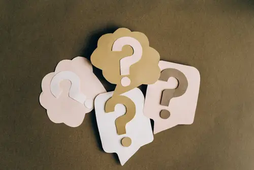 Image of question marks on a brown background