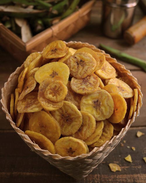 Image of dried banana chips in a woven basket