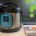 Instant Pot with cookbook on top of a modern kitchen cooktop