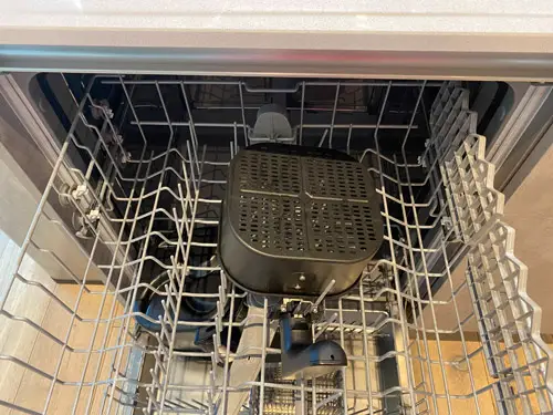 Philips Air Fryer basket inside the top shelf of a dishwasher