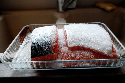 Frozen salmon covered with ice crystals