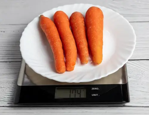 Carrots on a kitchen scale